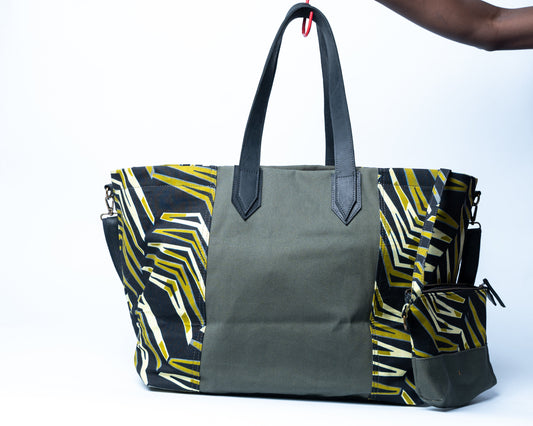 Gray tote bag with colorful geometric pattern on a white background