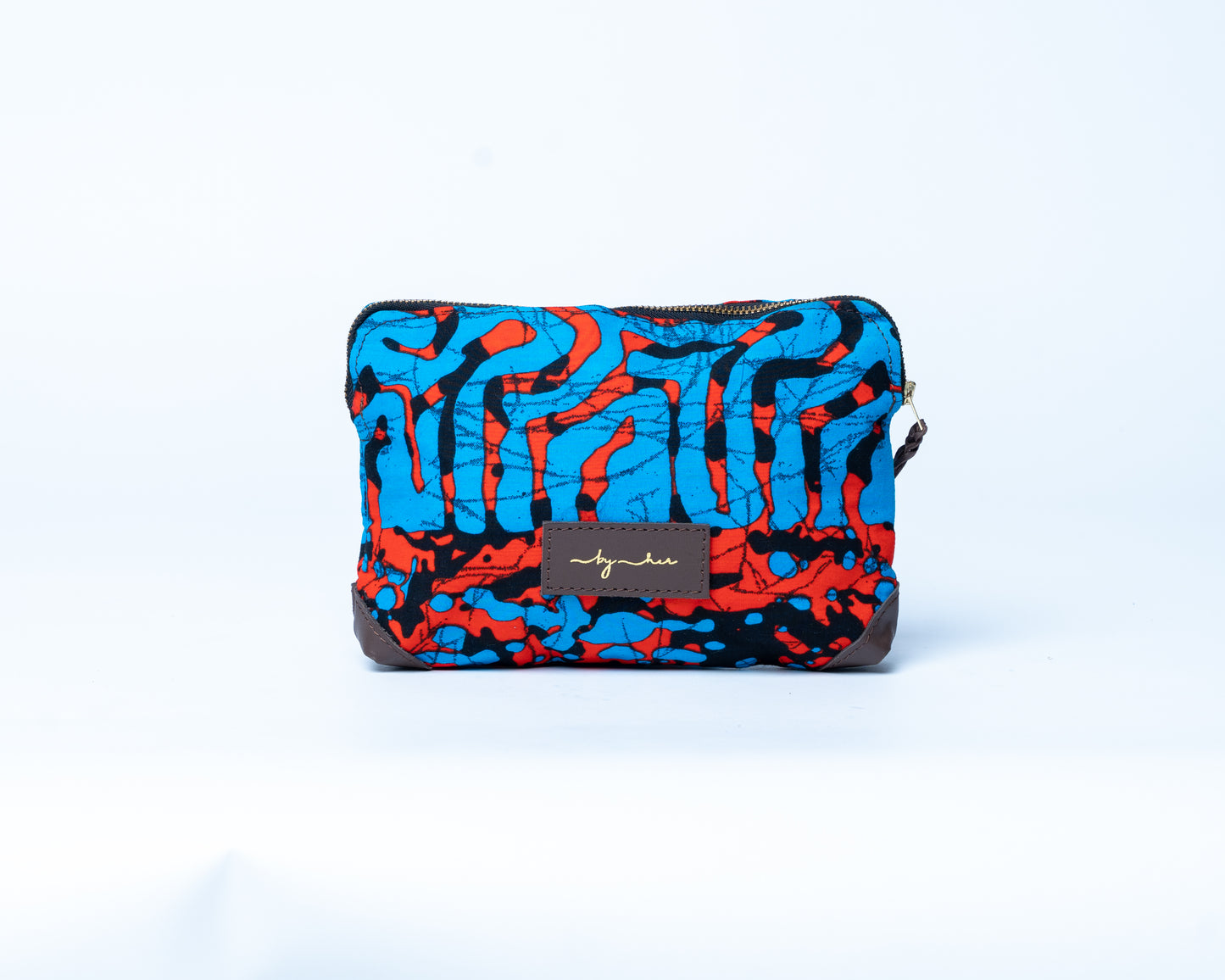 Colorful patterned pouch with a brand label on a white background