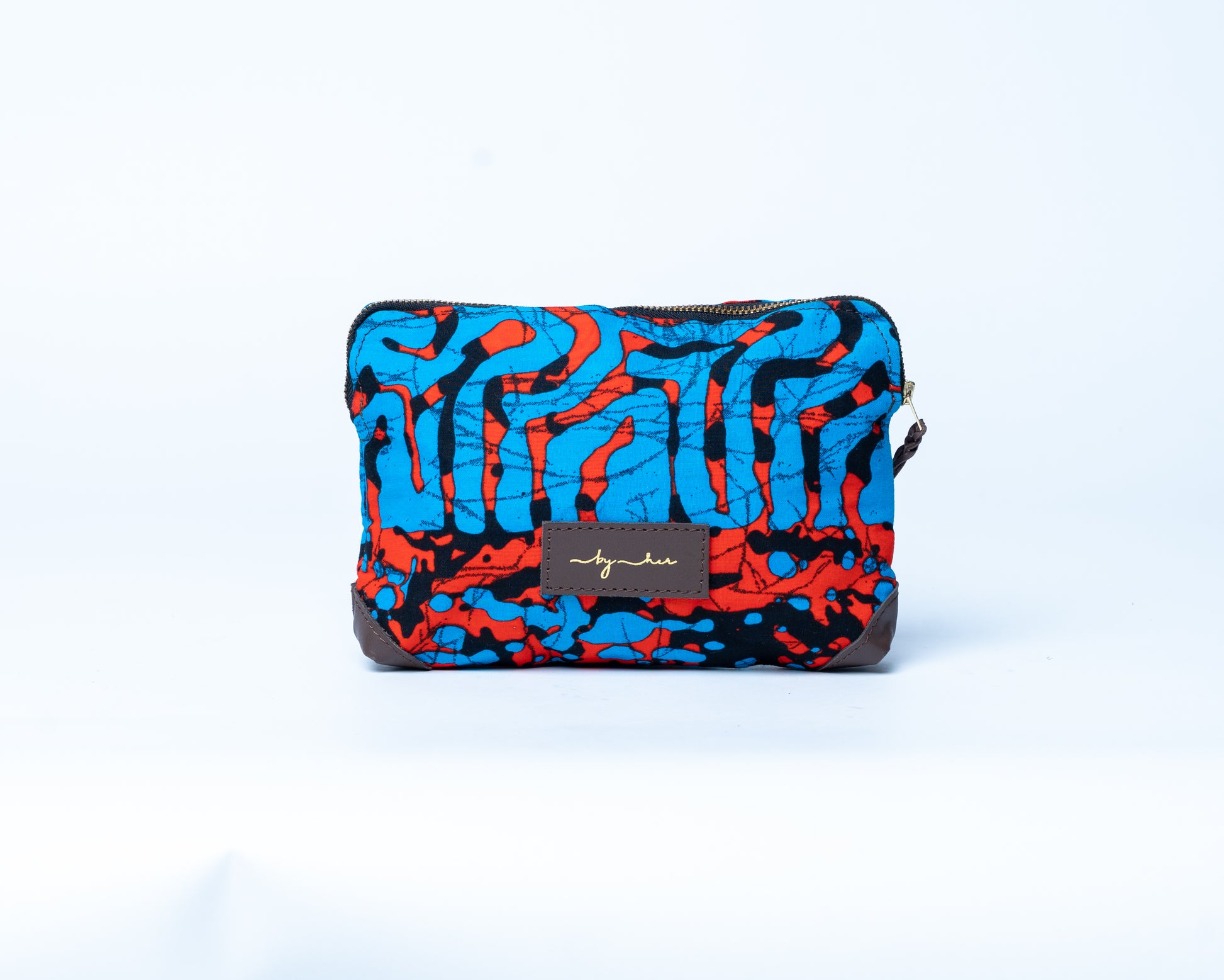 Colorful patterned pouch with a brand label on a white background