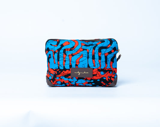 Colorful patterned pouch with a brand label on a white background
