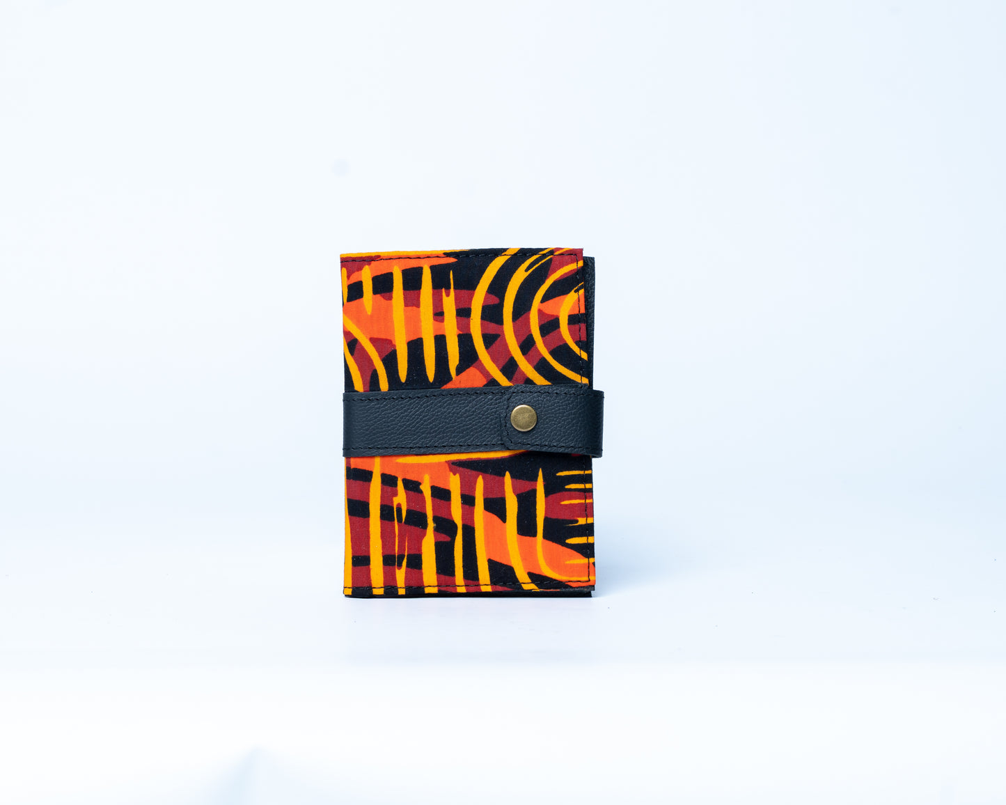 Small wallet with orange and black pattern on a white background