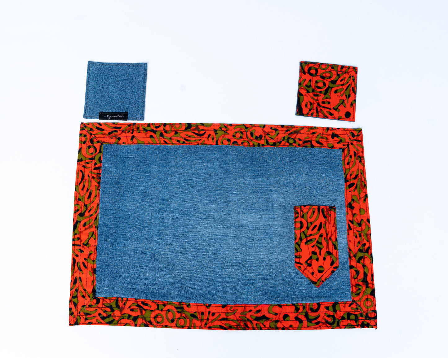 Placemat with red and green pattern on a white background