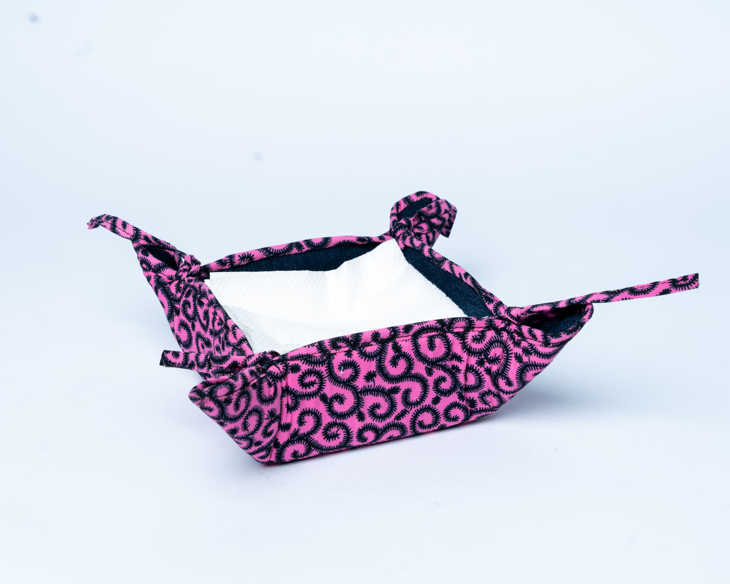 Pink and black leopard print hammock on a light blue background