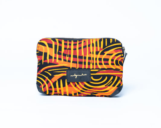 Colorful patterned pouch with a brand label on a white background