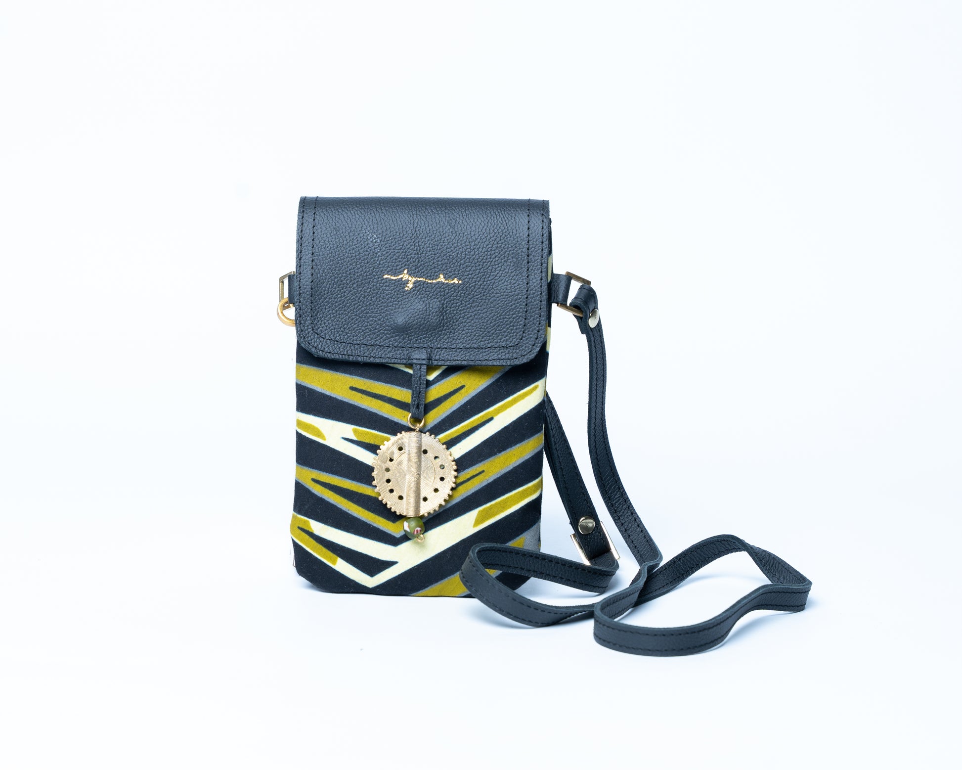 Black and yellow patterned crossbody bag on a white background