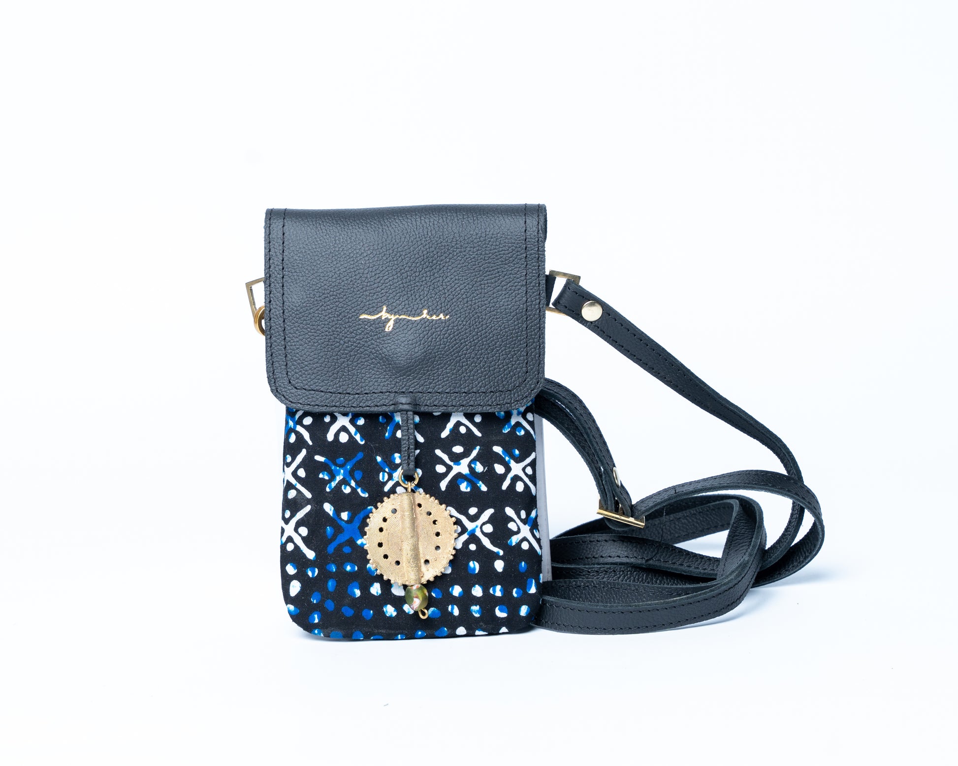 Small crossbody bag with blue patterned flap on a white background