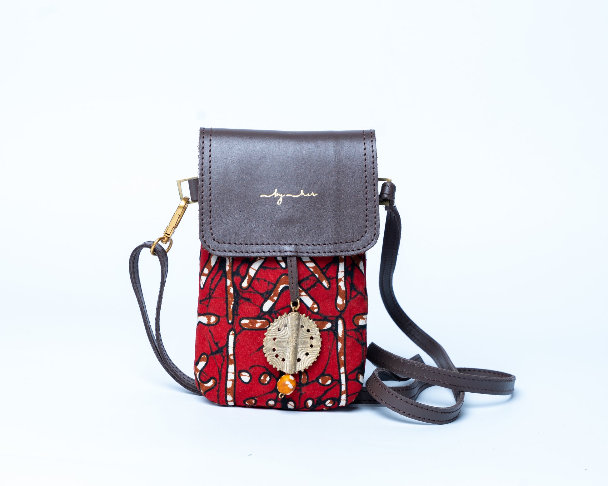 Small crossbody bag with red patterned body and gray top section on a white background