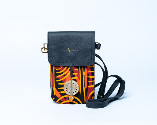 Black crossbody bag with colorful patterned flap on a white background