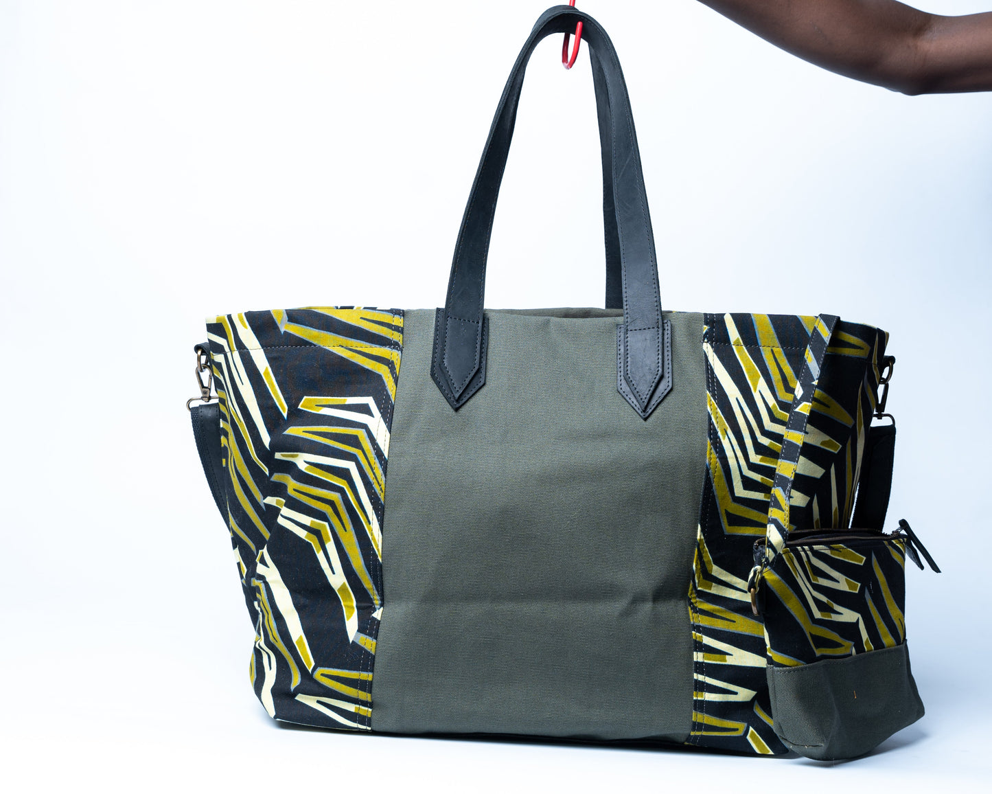 Gray tote bag with colorful geometric pattern on a white background