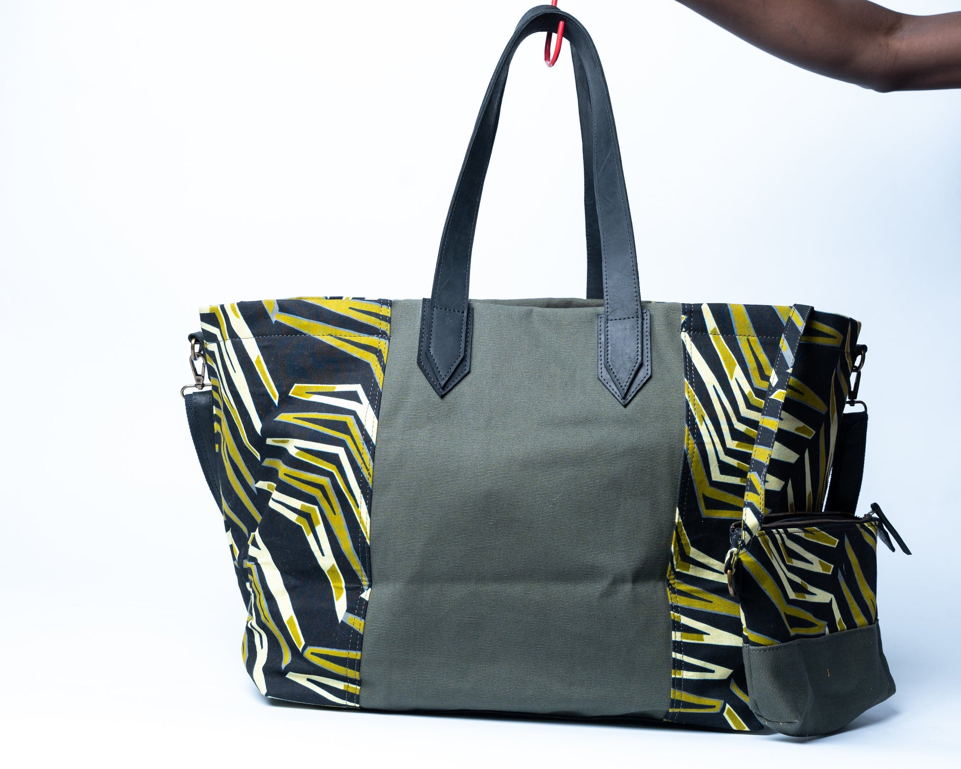 Gray tote bag with colorful geometric pattern on a white background