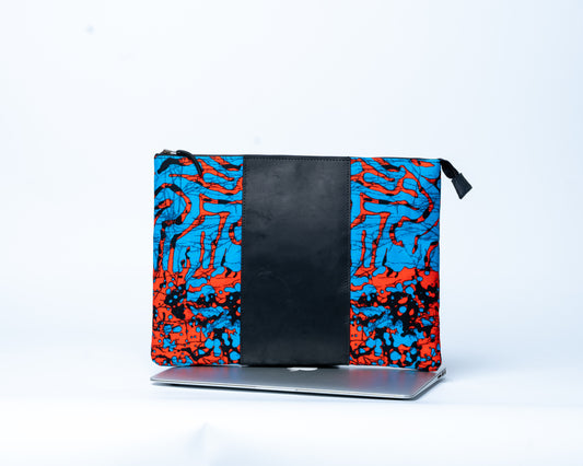 Colorful patterned pouch with black center on a white background
