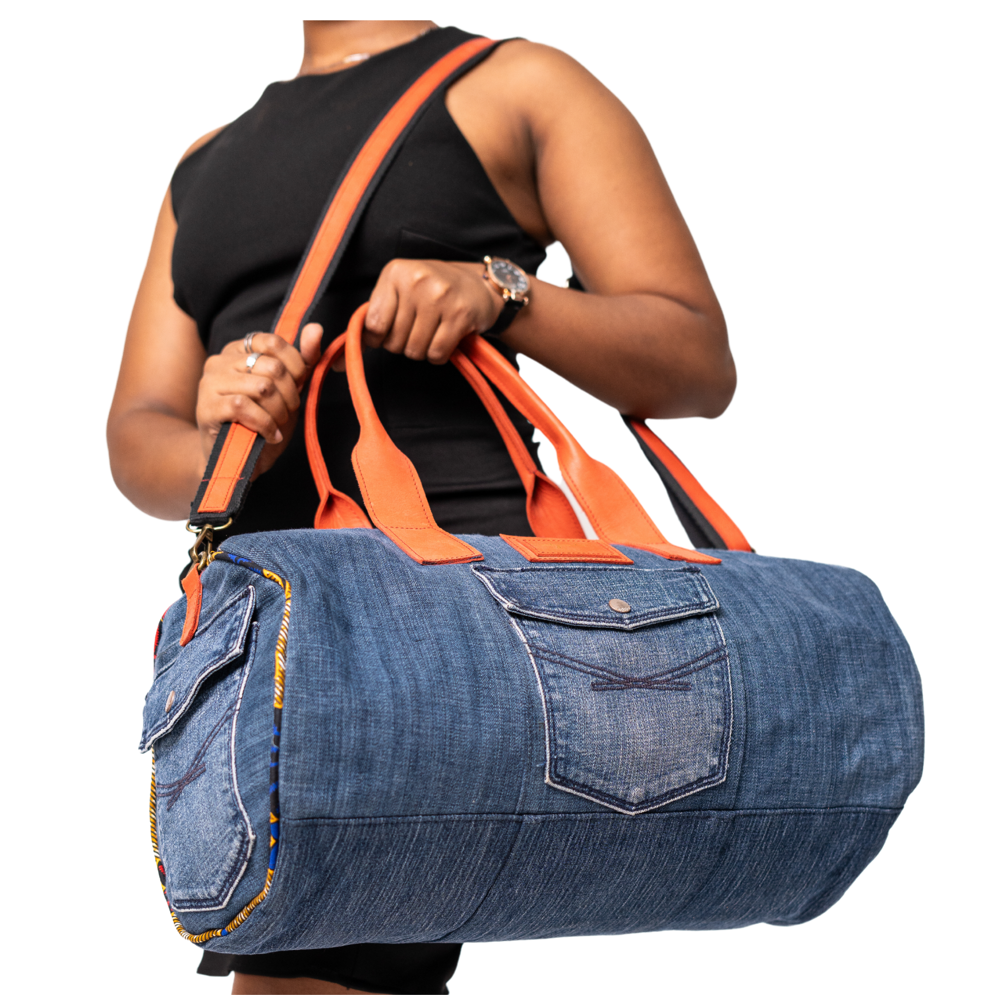 Person holding a blue and orange duffel bag on a white background
